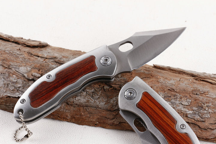 Browning F113 folding knife with wood and steel handle