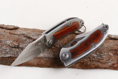 Browning F113 folding knife with wood and steel handle
